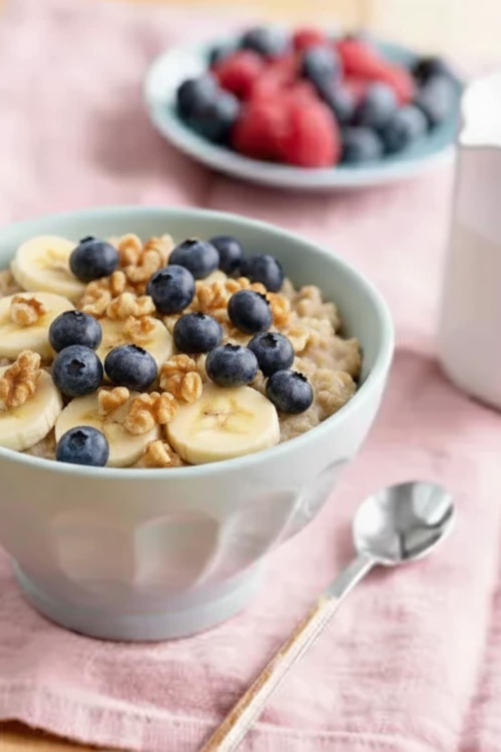 Anti-inflammatory banana oat breakfast bowl with fresh blueberries and walnuts - healthy superfood recipe for reducing inflammation and providing sustained energy