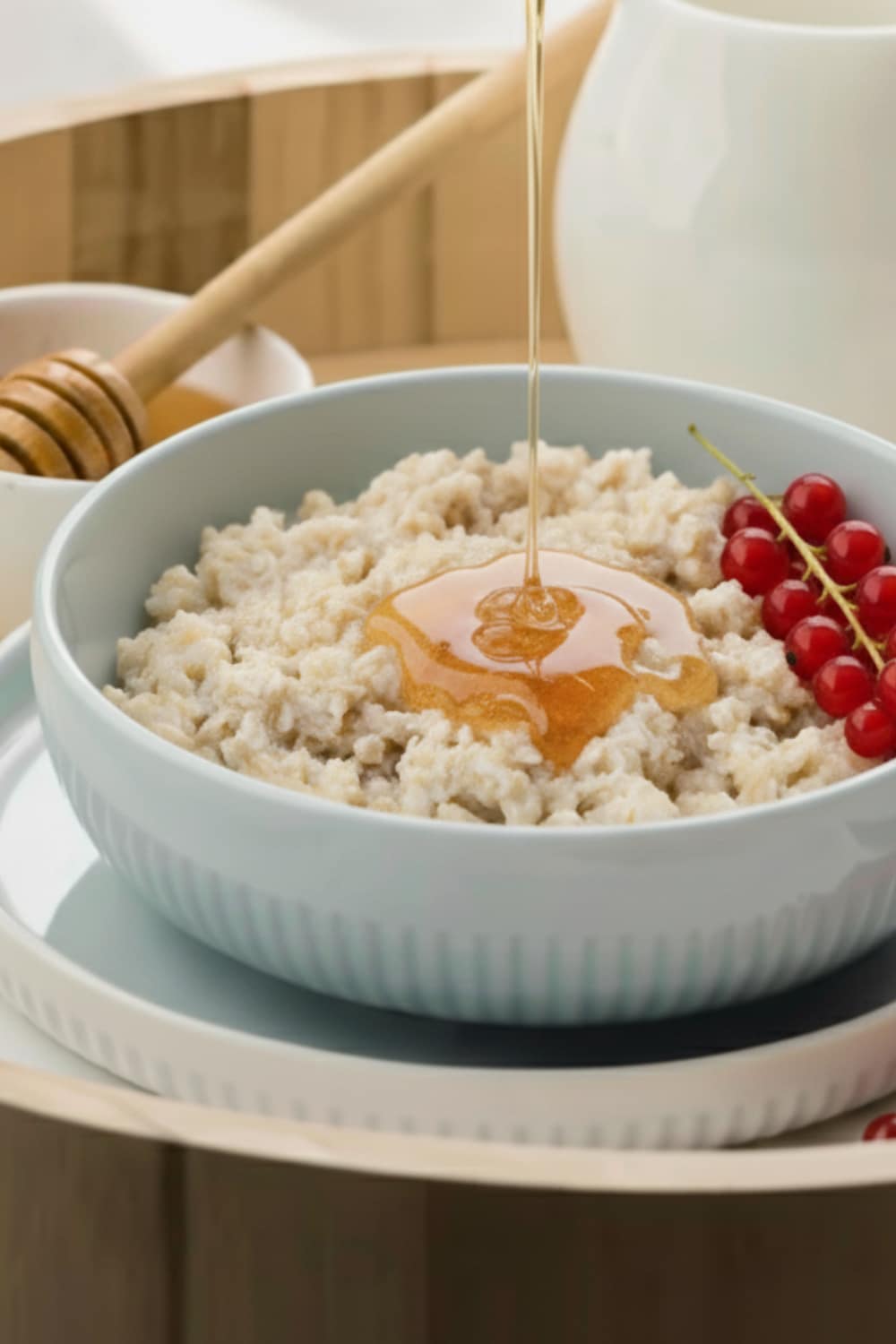 Anti-inflammatory honey oatmeal breakfast bowl with fresh berries and natural healing ingredients - healthy recipe for reducing chronic inflammation and boosting morning energy