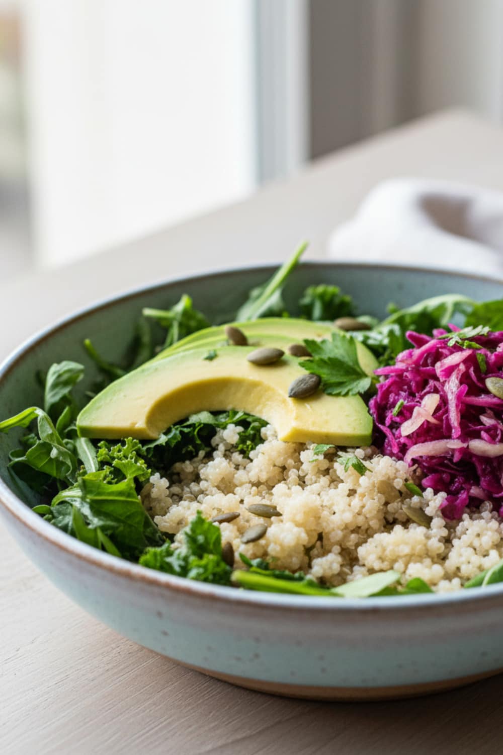Vibrant anti-inflammatory gut health bowl featuring fluffy quinoa, fresh greens, creamy avocado slices, and probiotic-rich purple sauerkraut, perfect for a nutritious and delicious meal.